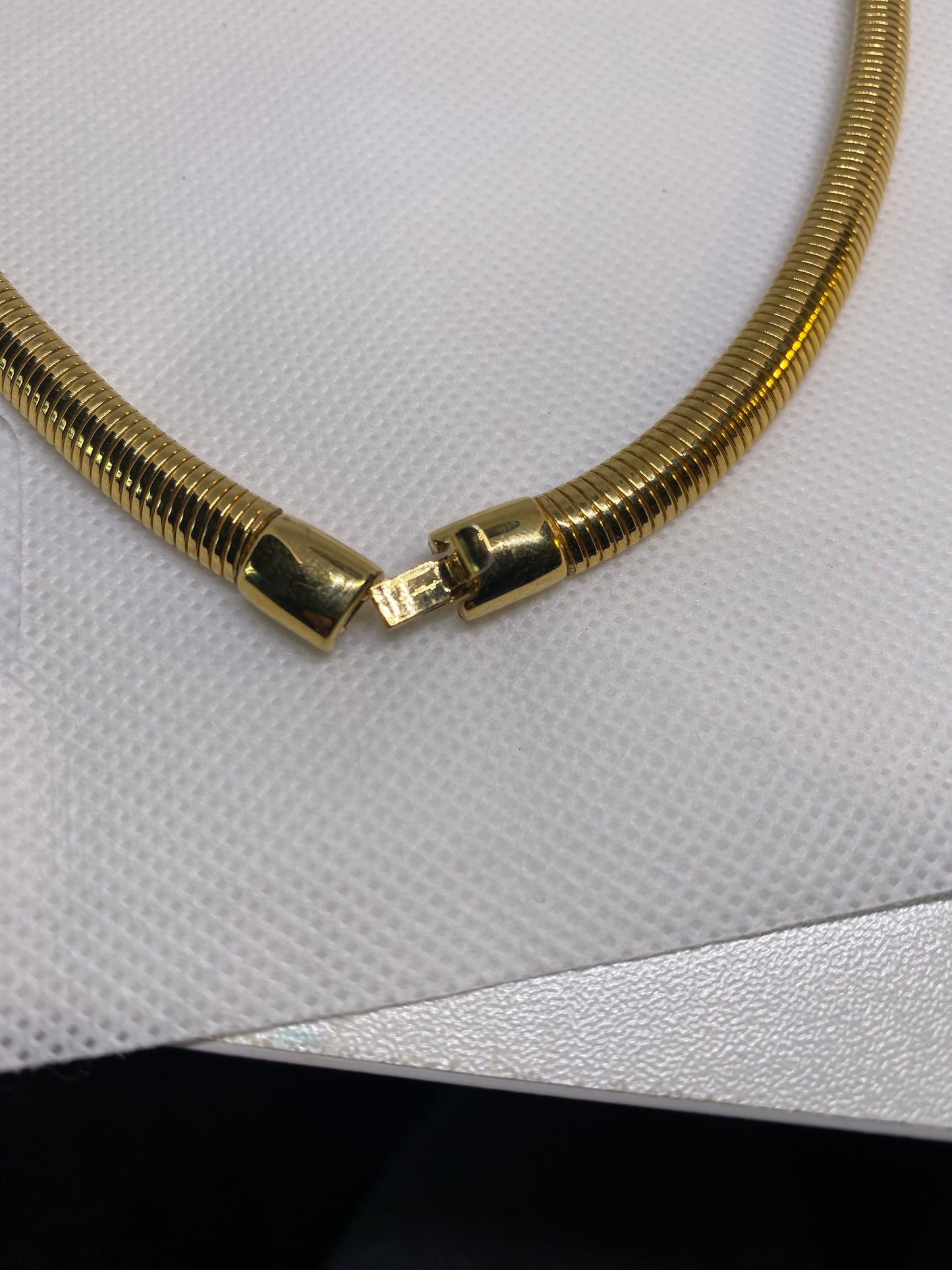 Monet omega checker stretch flex gold black enamel necklace