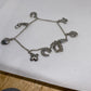 Brighton charm braclet sliver in tone hearts and hotshot cross, 7”
