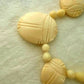 1920 Carved Scarab Necklace Egyptian Revival Cream Beads made from Lucite Rare