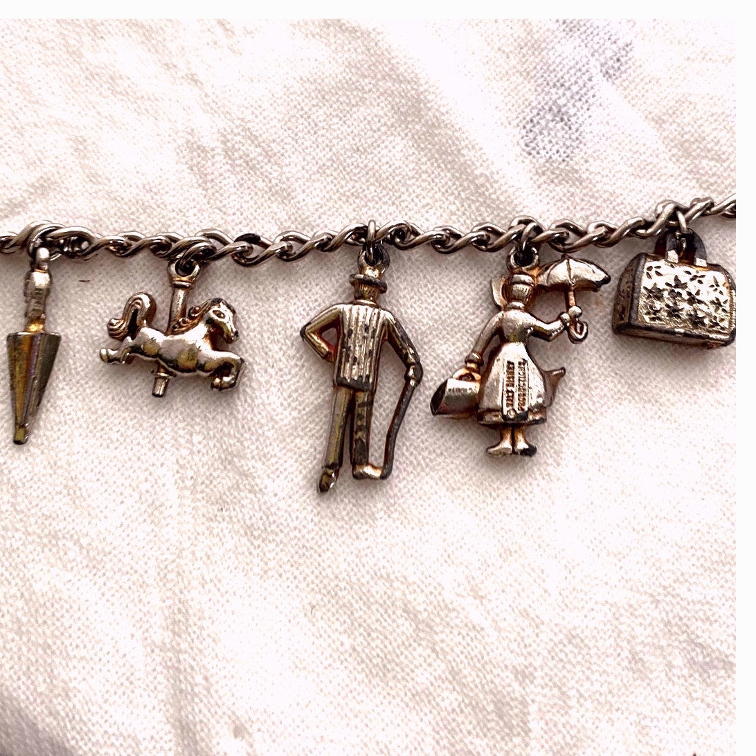 Vintage 1960s Disney Mary Poppins charm bracelet original collectible with umbrella, carousel horse, Bert, Mary, and carpet bag.