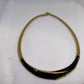 Monet omega checker stretch flex gold black enamel necklace