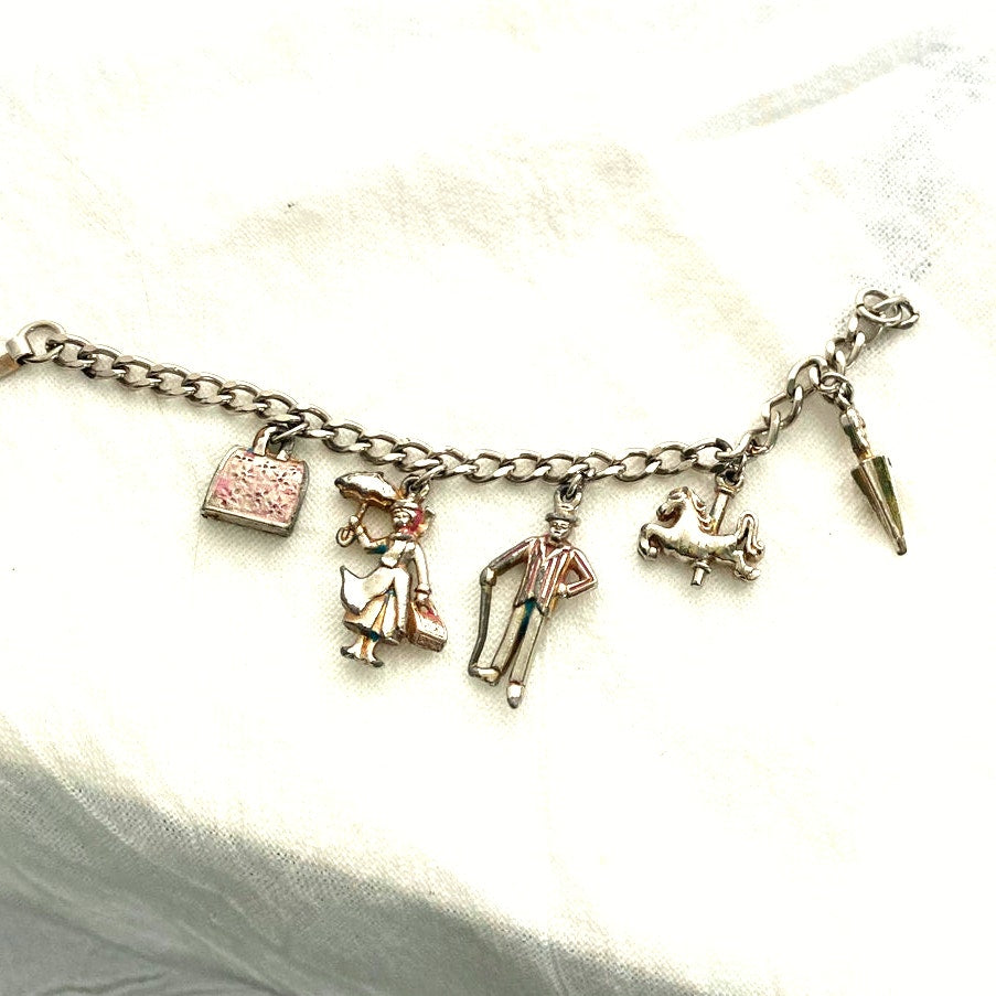 Vintage 1960s Disney Mary Poppins charm bracelet original collectible with umbrella, carousel horse, Bert, Mary, and carpet bag.