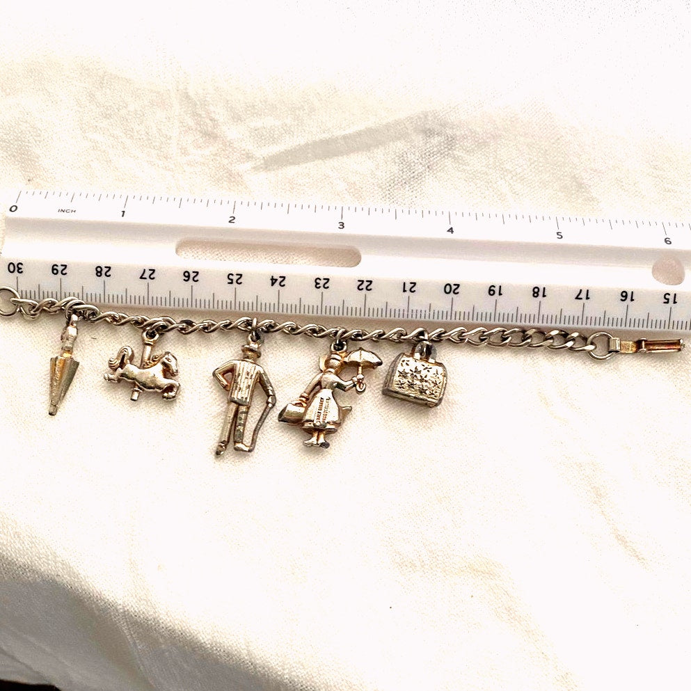 Vintage 1960s Disney Mary Poppins charm bracelet original collectible with umbrella, carousel horse, Bert, Mary, and carpet bag.