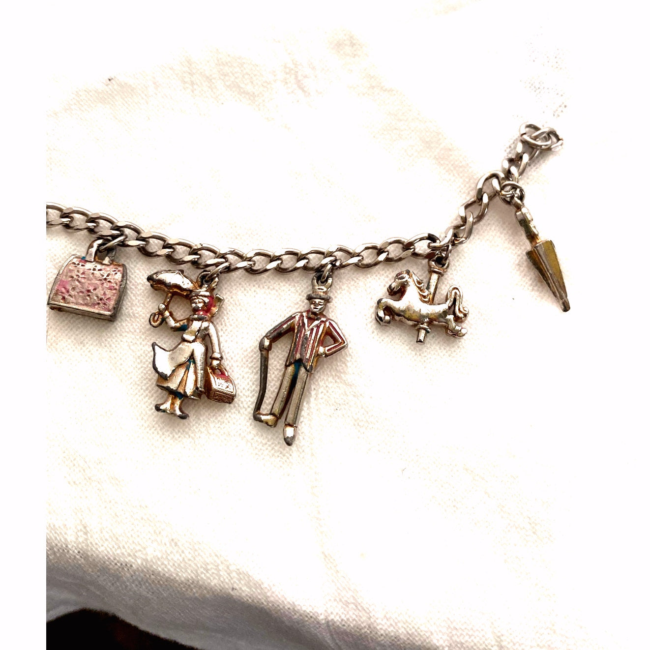 Vintage 1960s Disney Mary Poppins charm bracelet original collectible with umbrella, carousel horse, Bert, Mary, and carpet bag.