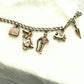 Vintage 1960s Disney Mary Poppins charm bracelet original collectible with umbrella, carousel horse, Bert, Mary, and carpet bag.