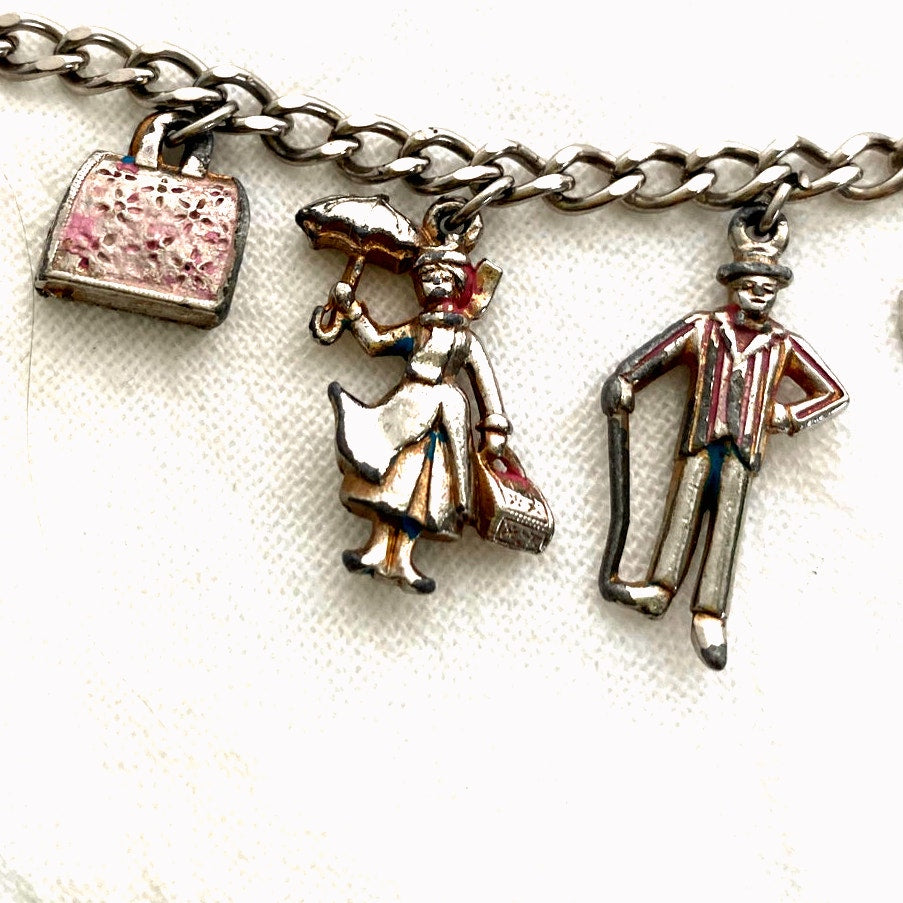 Vintage 1960s Disney Mary Poppins charm bracelet original collectible with umbrella, carousel horse, Bert, Mary, and carpet bag.